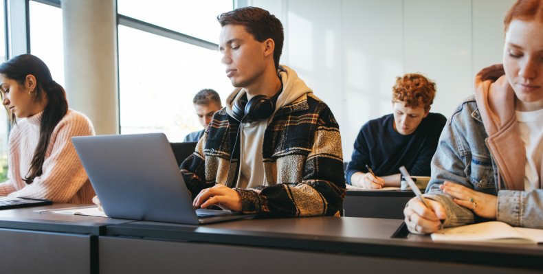 High school student on a laptop.