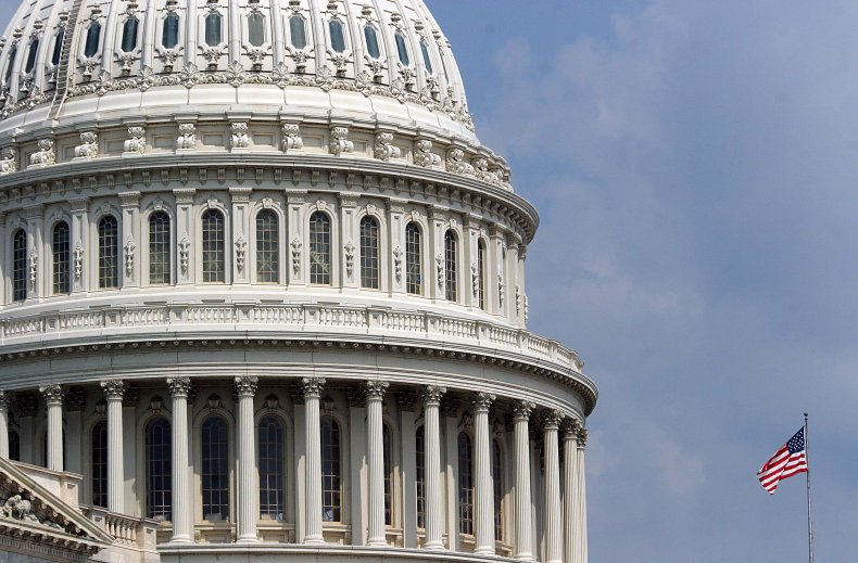 U.S. flag flying next to the Capitol