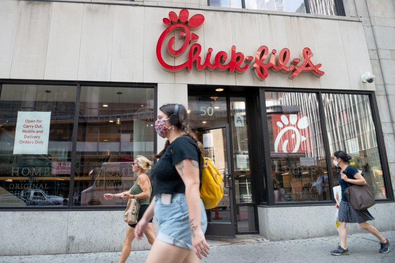 Pedestrians walk by Chick-Fil-A New York