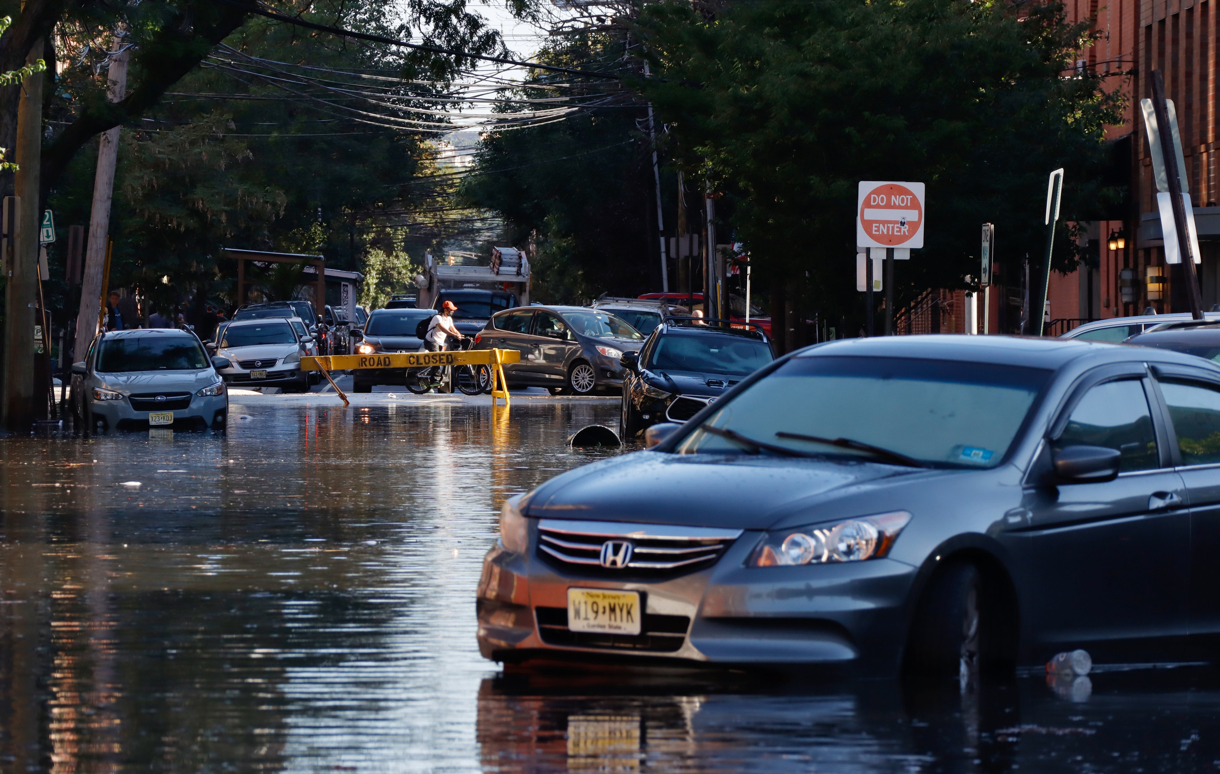 USPS Driver Celebrated Online After Helping Car Out of New Jersey Flooding