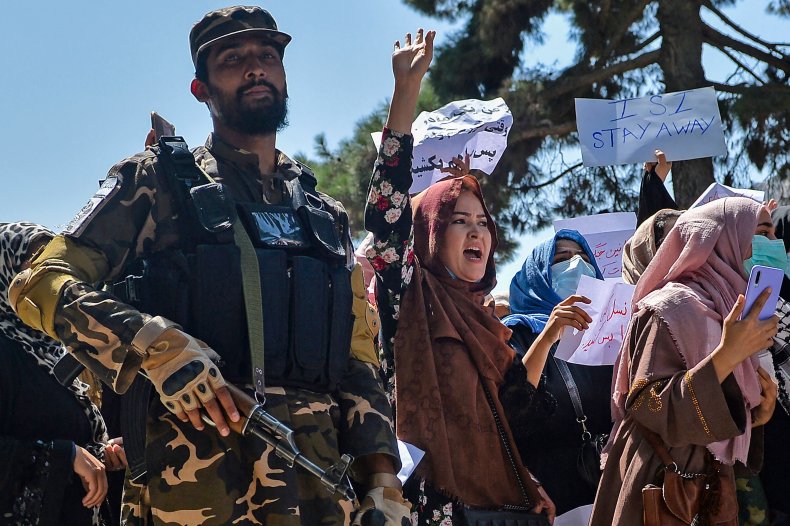 Taliban fighter and protester women in Kabul