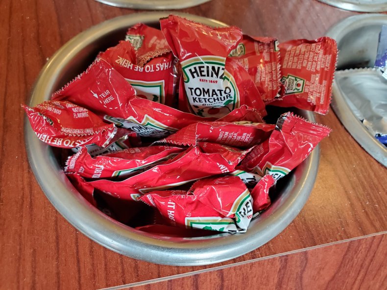 Ketchup sachets in a bowl