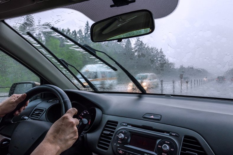 A motorist driving in through the rain.