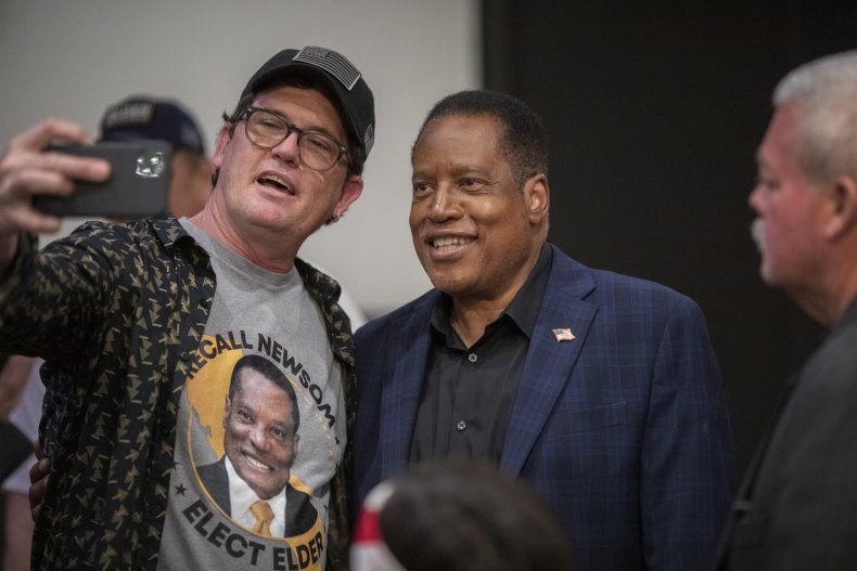 Larry Elder with a campaign supporter.
