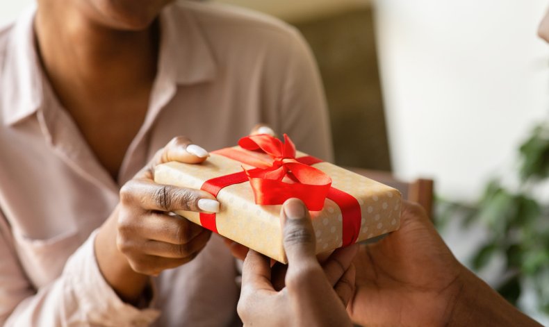 File photo of a present giving. 