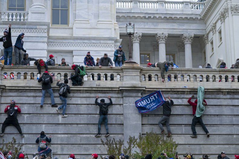 Capitol Rioters Climb Wall