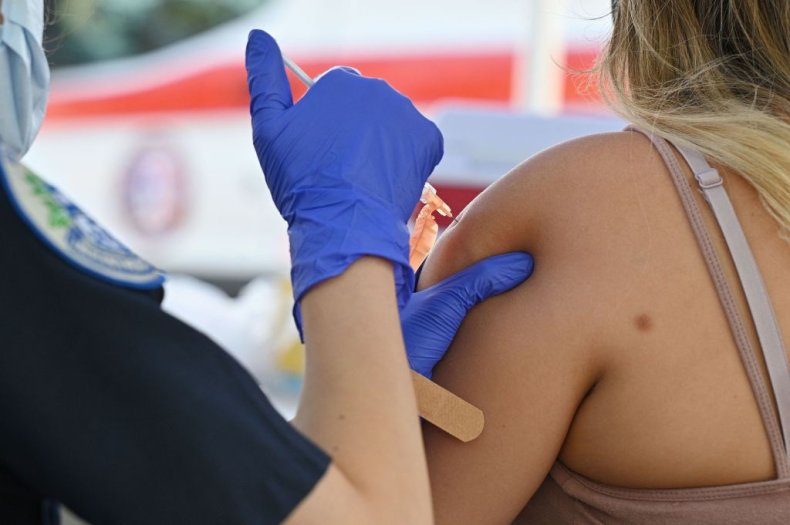 A woman receiving a COVID-19 vaccine injection