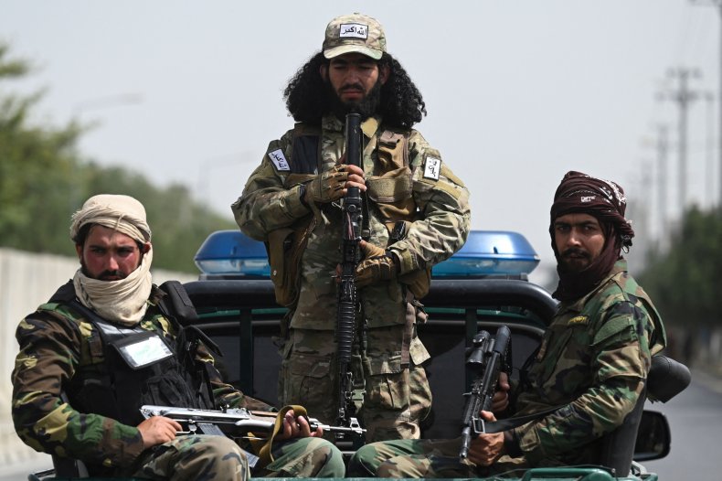 Taliban fighters guard a rally in Kabul