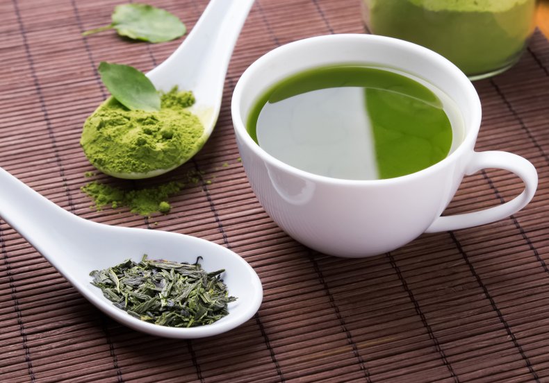 A cup of green tea and powder.