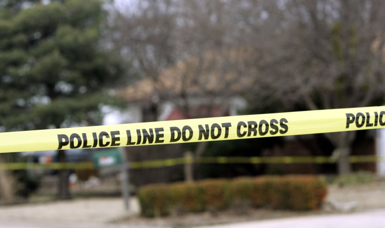 police tape woman's body found in freezer