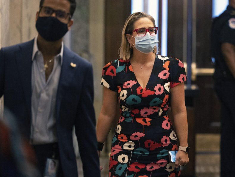 Sen. Kyrsten Sinema walks to Senate chambers
