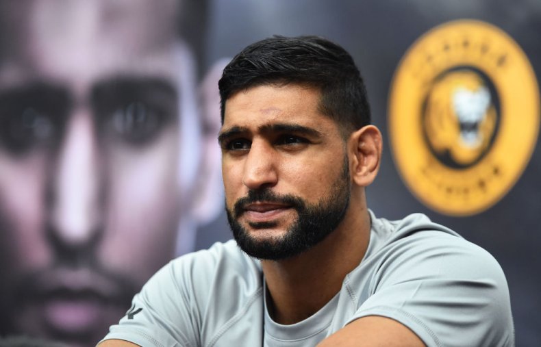 Amir Khan was escorted of the plane