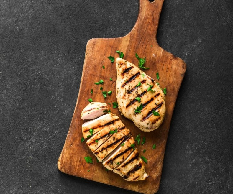 Stock image of chicken on wooden board