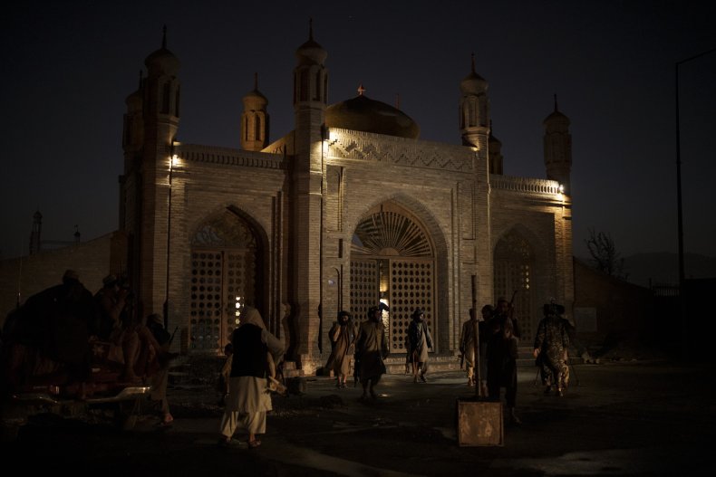 Taliban fighters after an explosion in Kabul