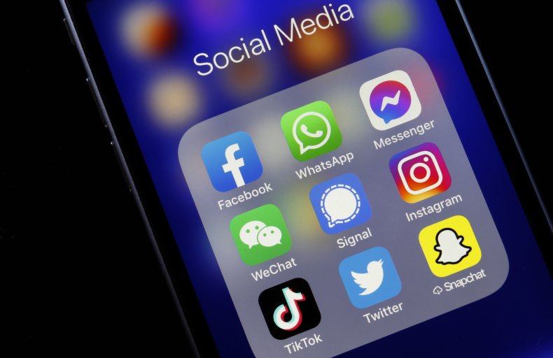 Social media app logos on a phone.