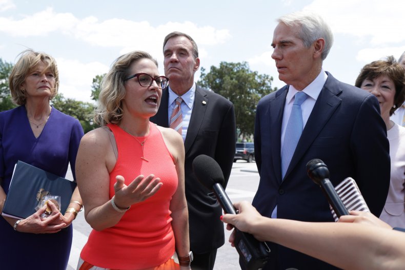 Kyrsten Sinema Appears With Senate Colleagues