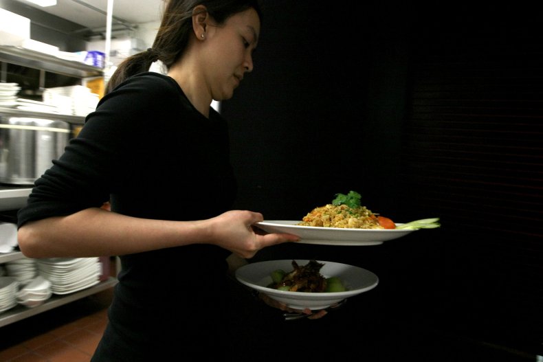 Waitress Holding Plates