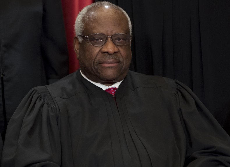 Clarence Thomas Poses for a Photo