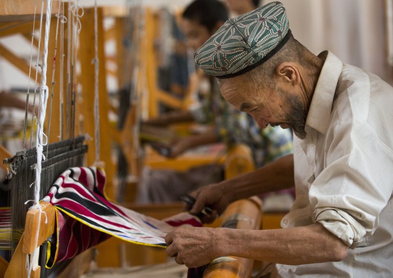 Uyghur worker in a silk factory, Hotan,