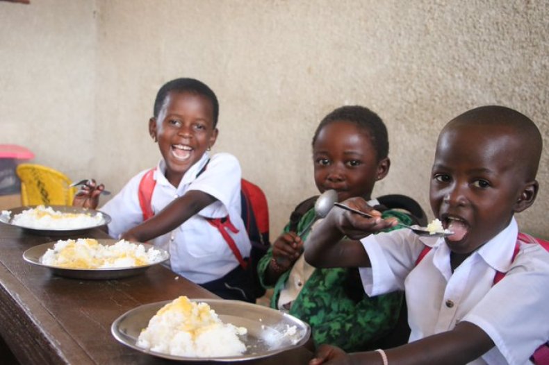 Children enjoying WFP school meals