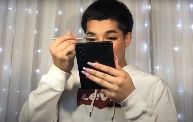 Daniel Diaz applying makeup