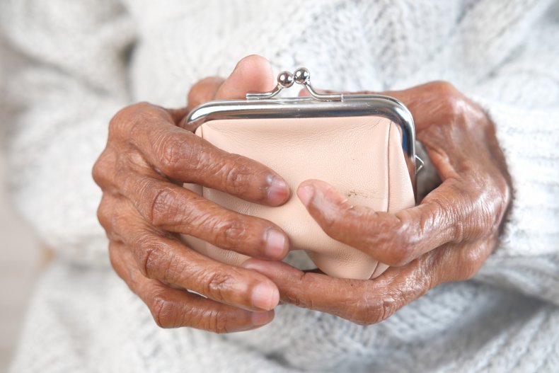 Old woman holding purse