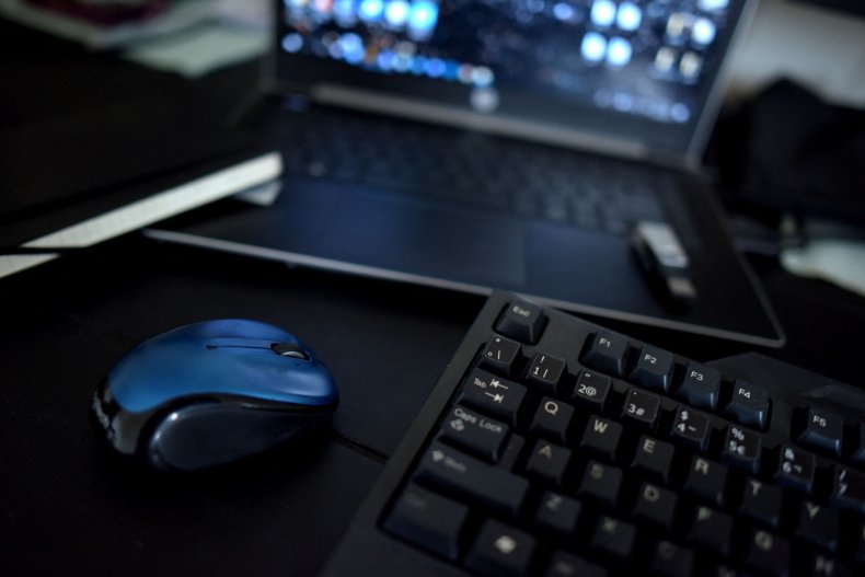 A home office desk with a keyboard