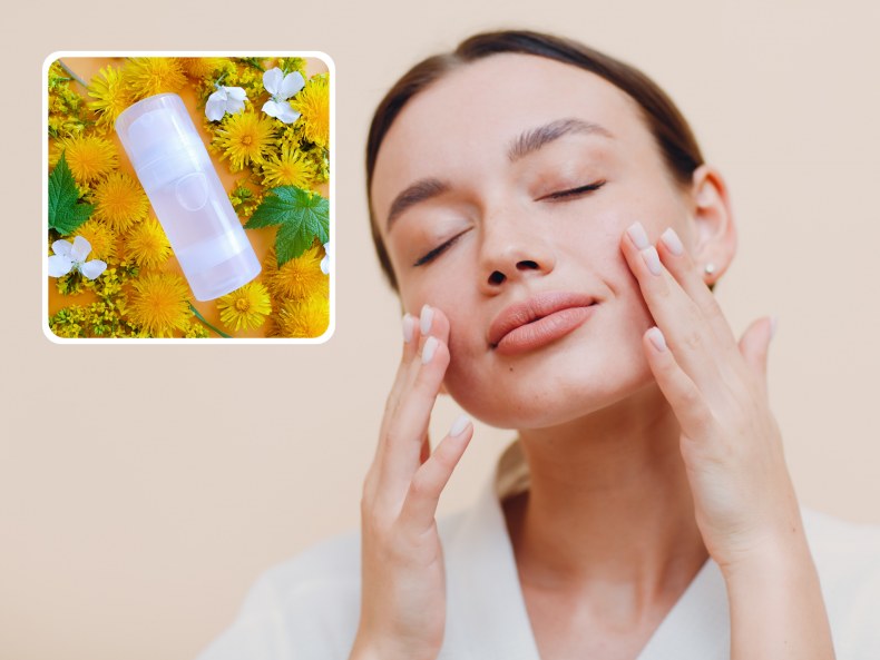 Woman applies cream to her face