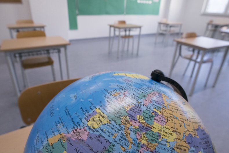 A globe is pictured in a classroom