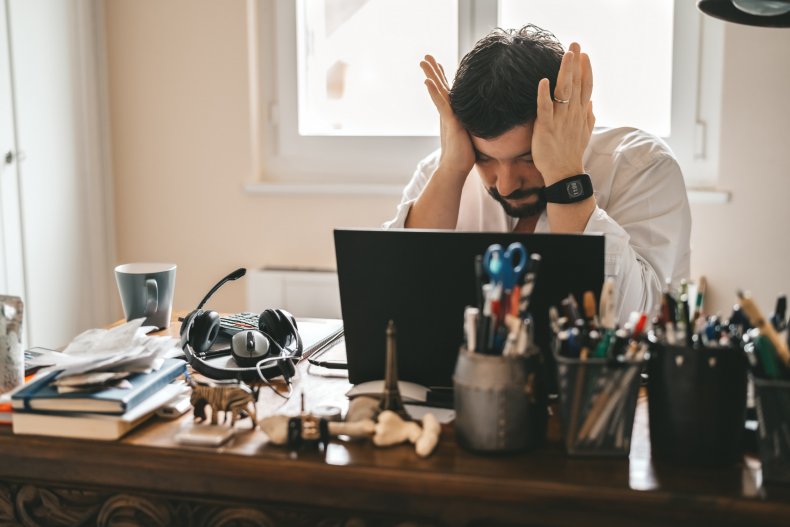 A man looking sad in an office.
