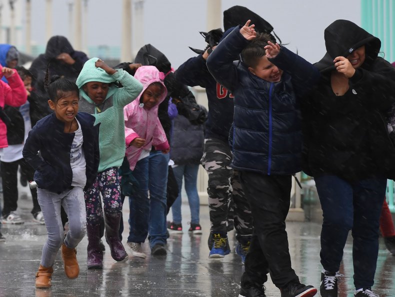 School students in the rain
