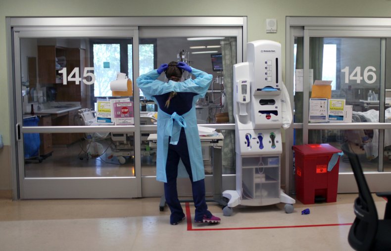 Nurse dons PPE