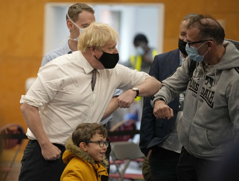 UK Prime Minister Boris Johnson greets members 