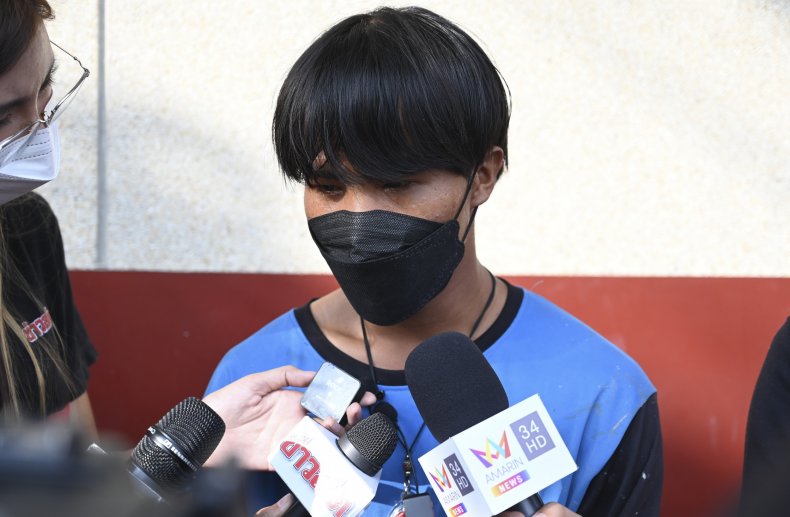 Woman Cuts Painters' Rope