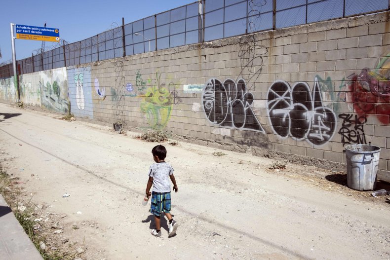 Migrant boy by Mexican border