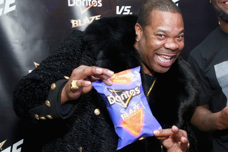 Busta Rhymes holds a packet of Doritos