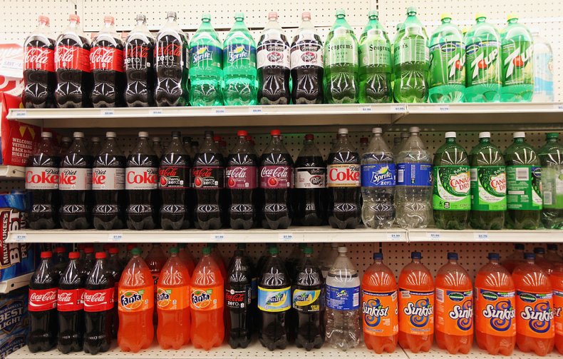 Father hands out large soda for Halloween