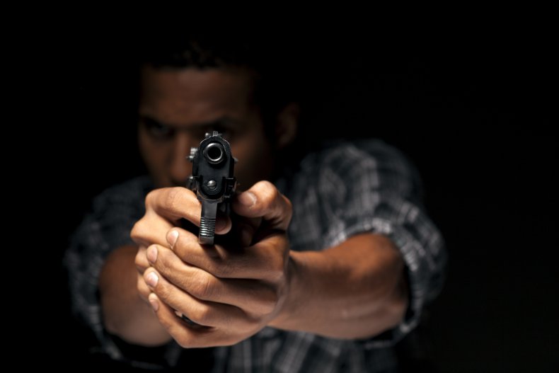 A man pointing a gun.
