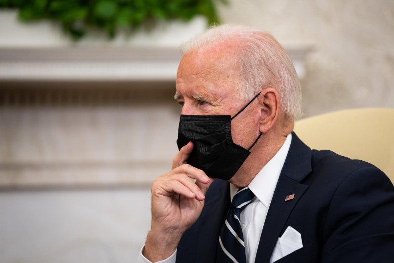 U.S. President Joe Biden listens during a 