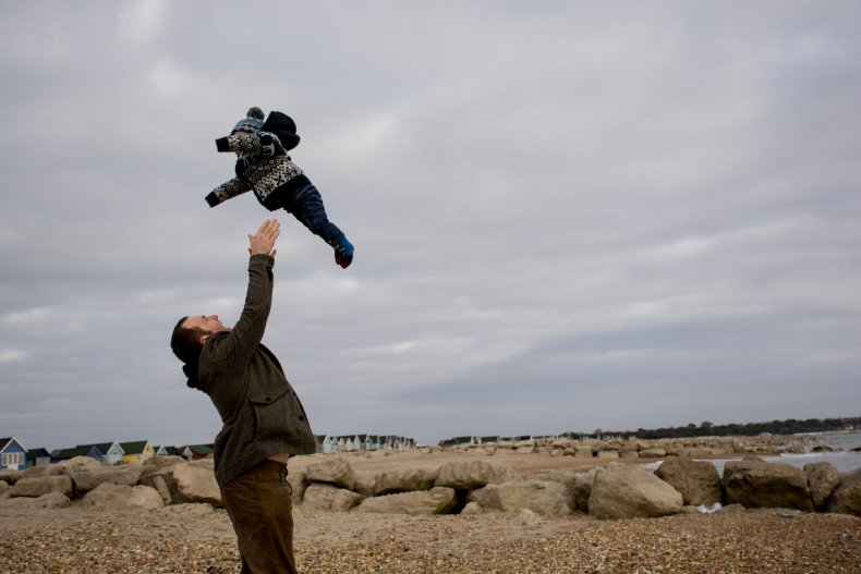 man catching baby