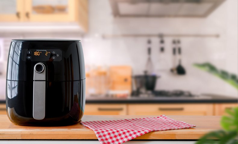 An air fryer device in a kitchen.