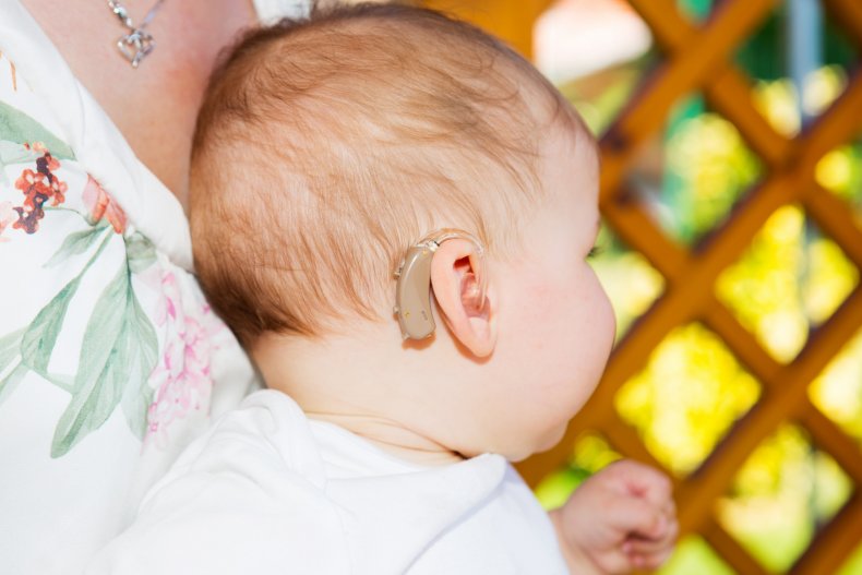 baby with hearing aid