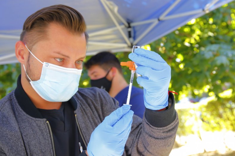 A Medical Staffer Prepares a Vaccine Shot