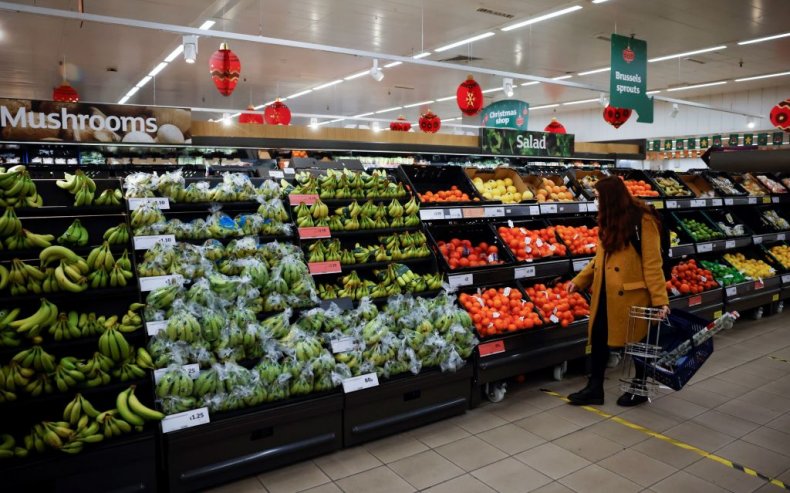 A woman shops for fruit