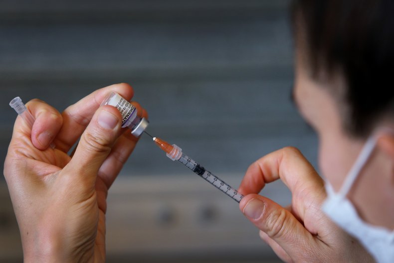 nurse prepares Pfizer-BioNTech COVID-19 vaccine