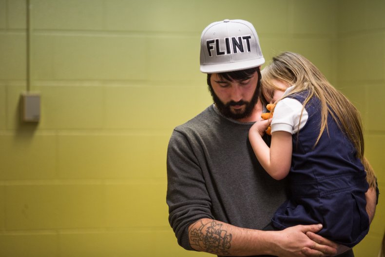 Flint water crisis lawsuit settlement children benefit