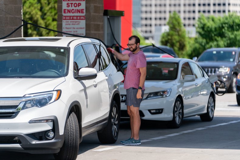 Motorist filling car with gas