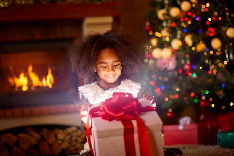 A child excited to open a gift.