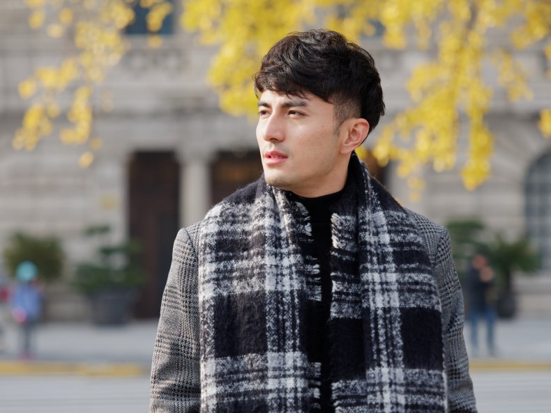A man wearing a scarf in winter.