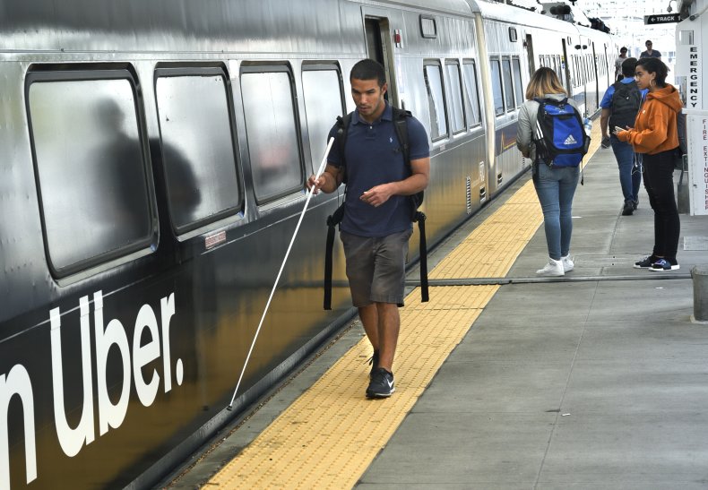 A blind man in the subway.